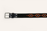 The Texas Exes II by Zilker Belts is crafted from black Argentine suede leather, featuring a silver double-prong buckle and brown geometric embroidery on the strap.