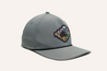 The Zilker Sessions Imperial Hat by Zilker Belts is a grey baseball cap with a multi-colored embroidered patch featuring a stylized animal, prominently positioned on the front panel.