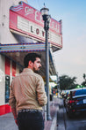 A man wearing a Midnight Rider jacket by Zilker Belts.