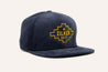 A Zilker Belts Corduroy Hat with a yellow logo on it.