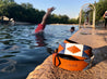 A person is swimming in a pool wearing a Zilker Belts Deep Eddy leather bracelet.